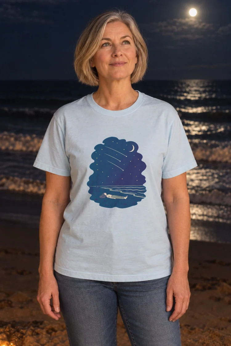 AI-generated image of a fictional model wearing the Falling Stars Tee in Chambray, size M, at 5′5″ tall.