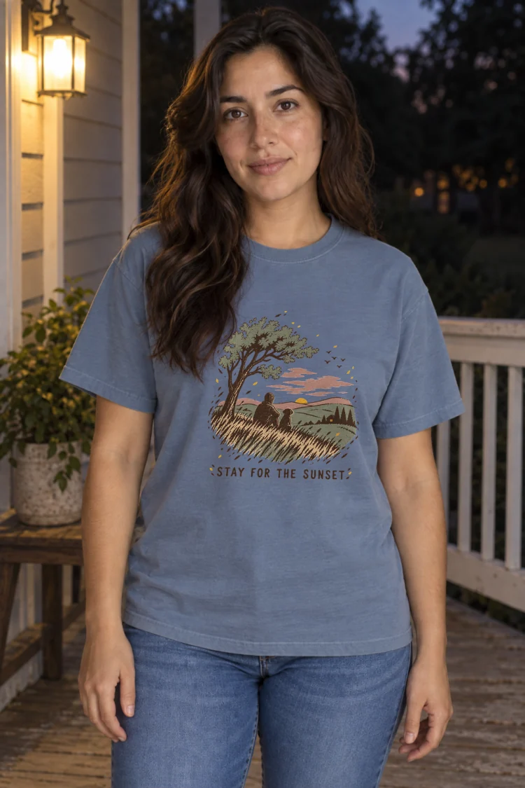 AI-generated image of a fictional model wearing the Stay for the Sunset Tee in Blue Jean, size M, at 5′4″ tall.