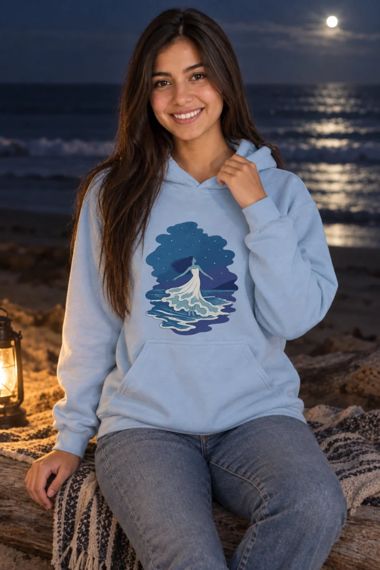 AI-generated image of a fictional model wearing the The Tide Dancer Hoodie in Light Blue, size S, at 5′4″ tall.