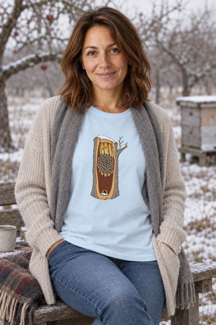 AI-generated image of a fictional model wearing the Honeybees in Winter Tee in Chambray, size M, at 5′4″ tall.