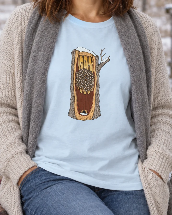 AI-generated image of a fictional model wearing the Honeybees in Winter Tee in Chambray, size M, at 5′4″ tall, cropped to the print.
